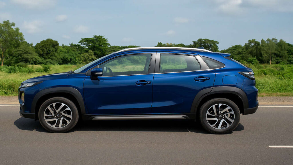 Blue Maruti Fronx full side profile on an open road.