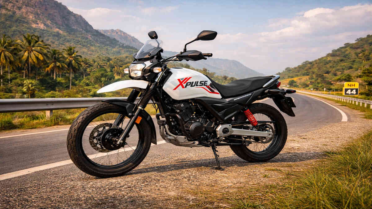 Hero Xpulse 160 in white colour on an Indian road, 16:9 wide realistic shot, no rider.